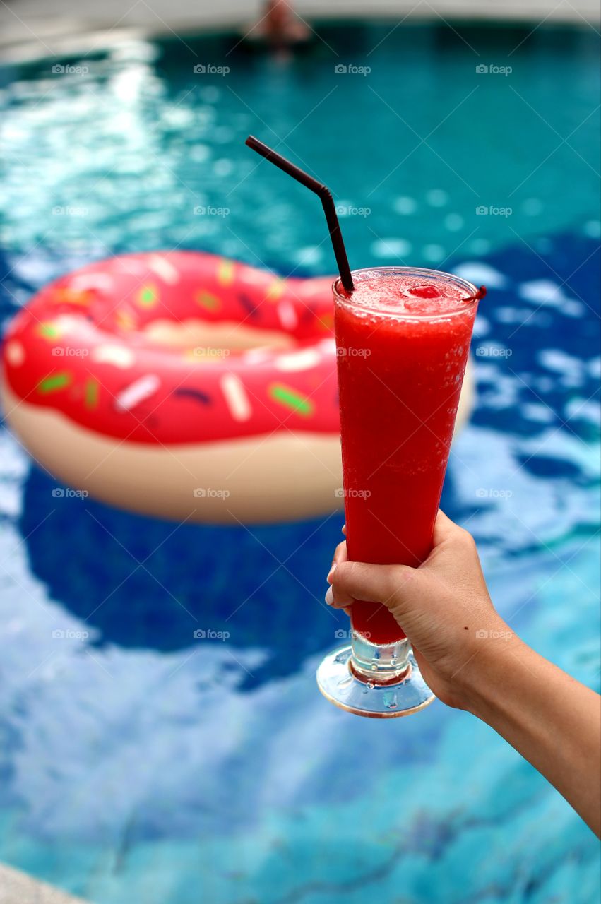 refreshing drink by a pool
