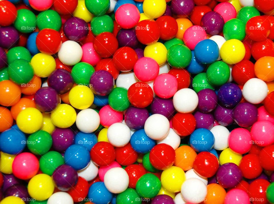 An array of multi colored gum balls. 