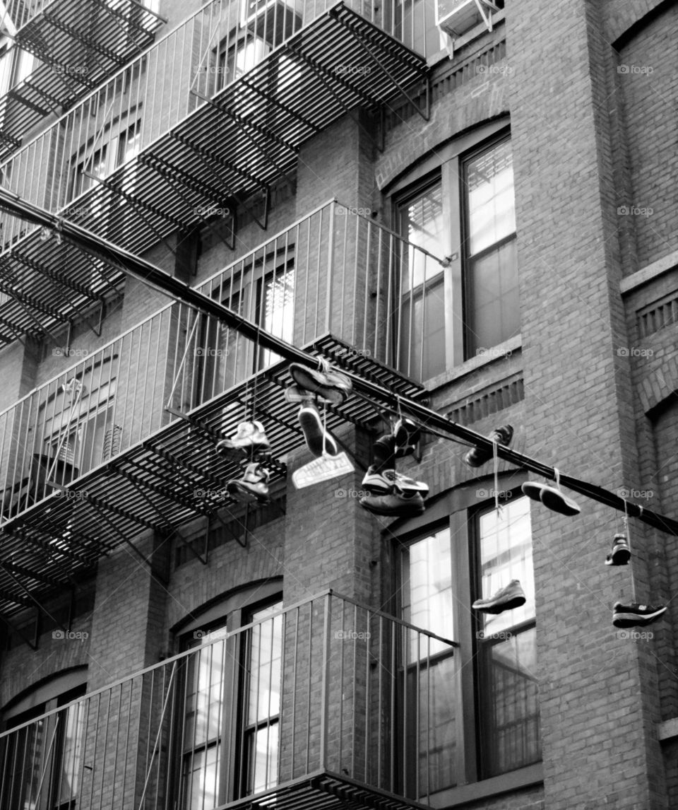 Shoes hanging in Brooklyn sky