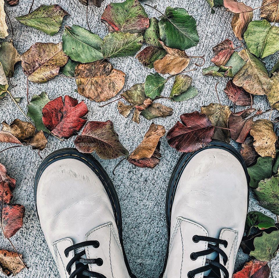 Doc Marten White Boots, classic Doc Marten boots and leaves, wearing Docs in the fall, Dr. Martens with autumn leaves, colorful leaves with white boots, walking in the autumn leaves wearing DMs, Doc Marten advertising