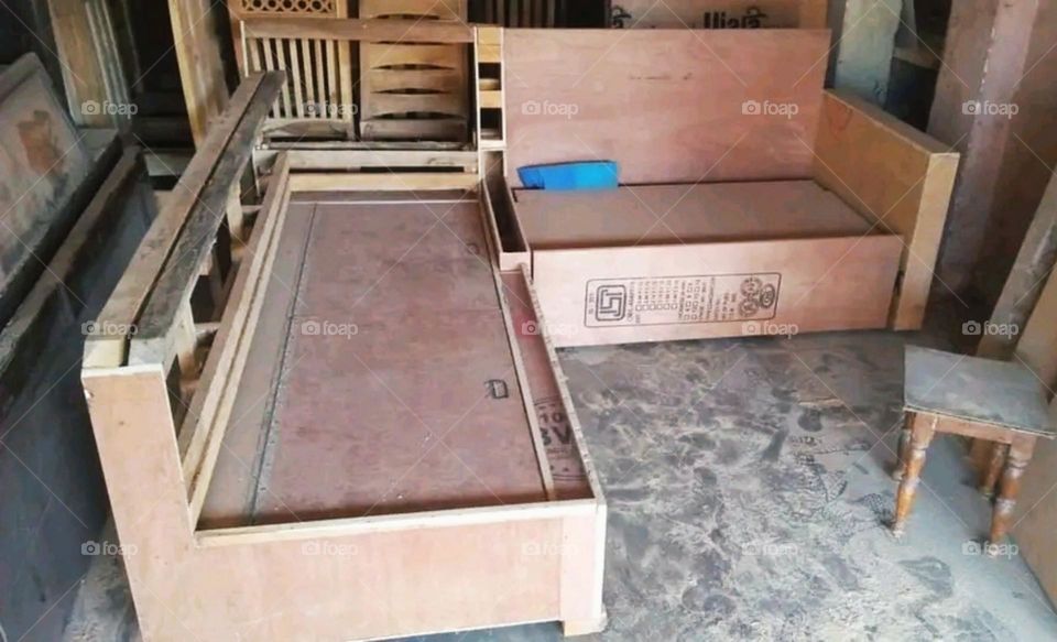 A carpenter building two new sofas.