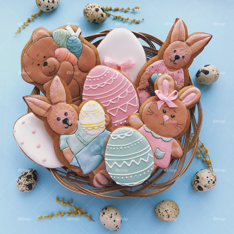 Cute happy Easter cookies. Rabbit with eggs