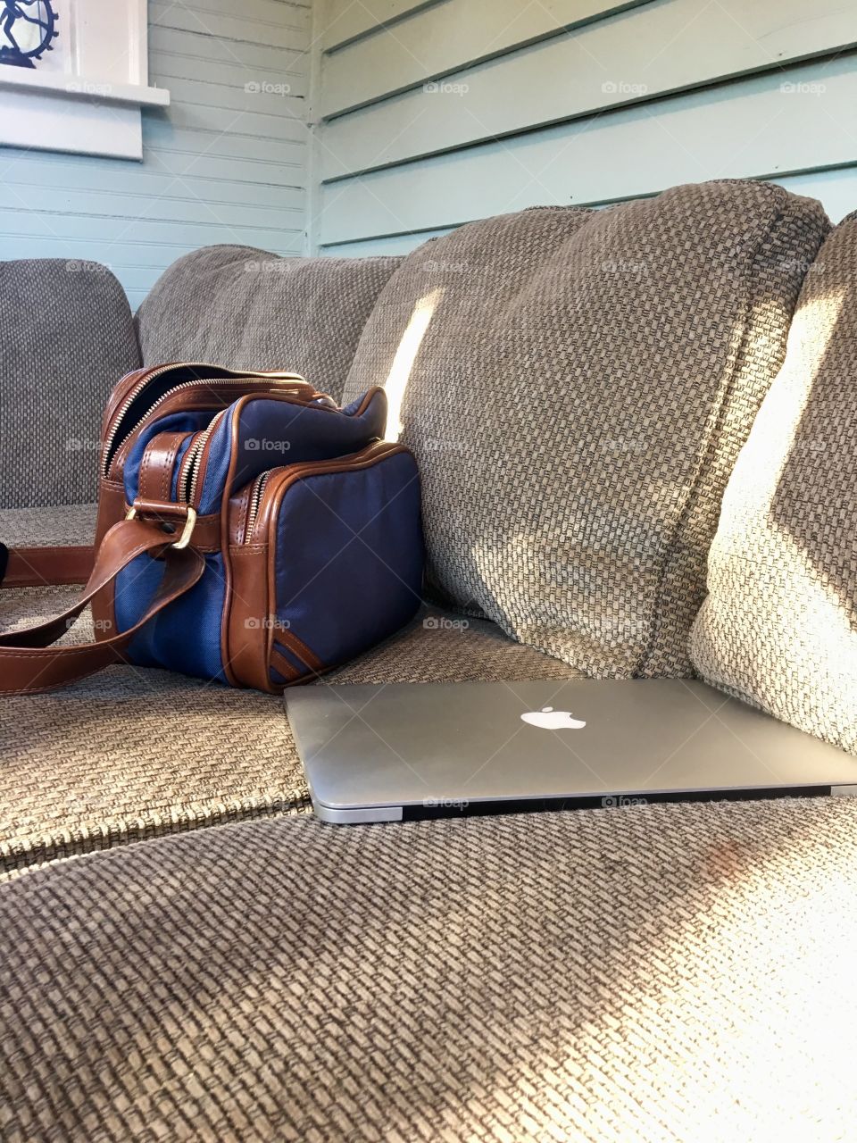 A blue bookbag and a MacBook 