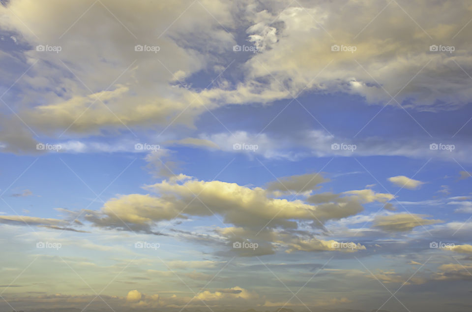 The beauty of the sky with clouds and the sun.