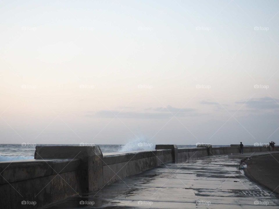 Sunset on the Malecón in Havana, Cuba with decent, bright and romantic lightning.