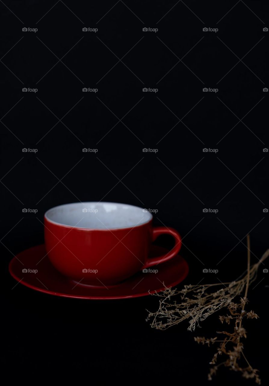 a red cup with black background