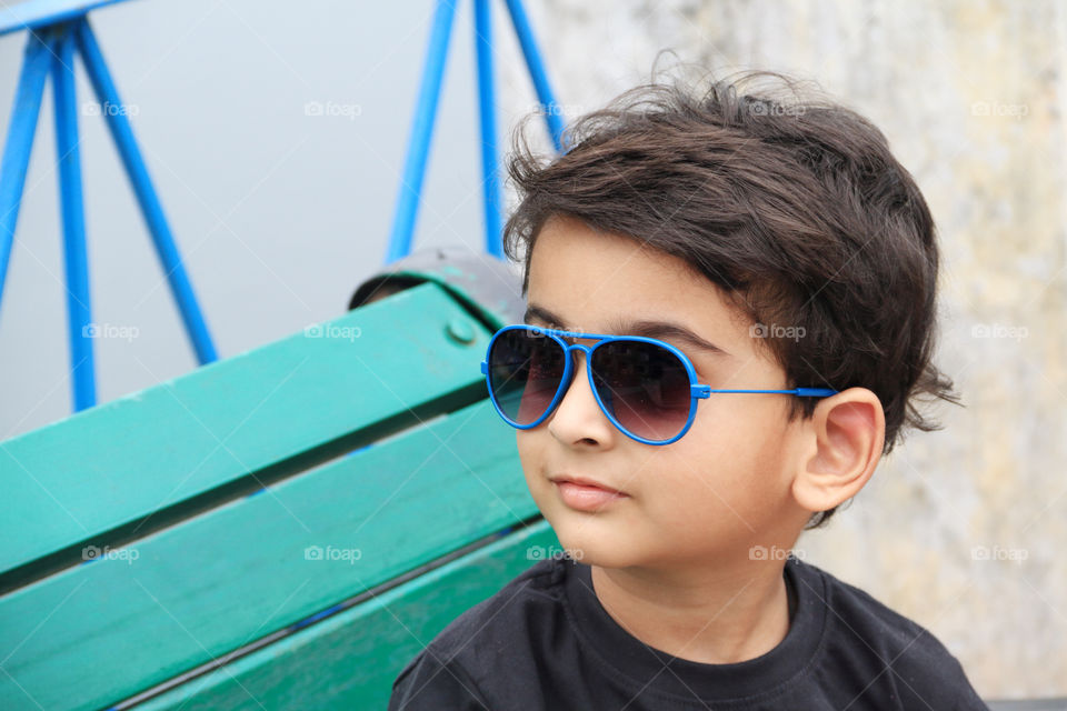 Cute Indian boy child with sunglasses