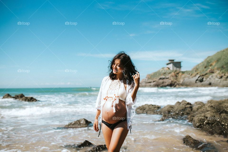pregnant on seashore.