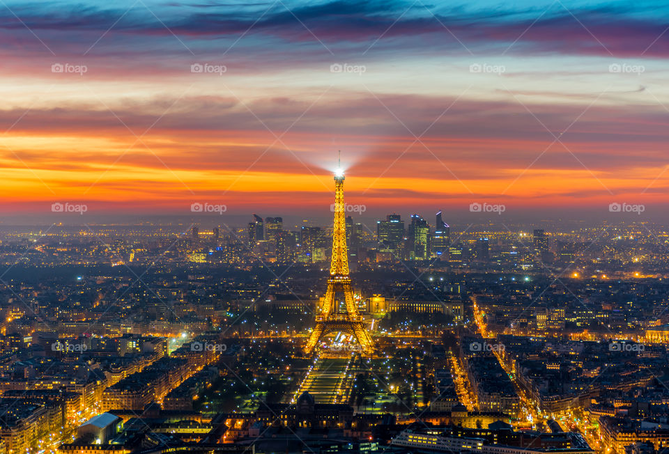 Eiffel Tower lights. the iconic Eiffel Tower at sunset lighting up Paris