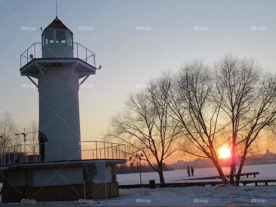 sunset in winter, lighthouse, evening, frost and sun