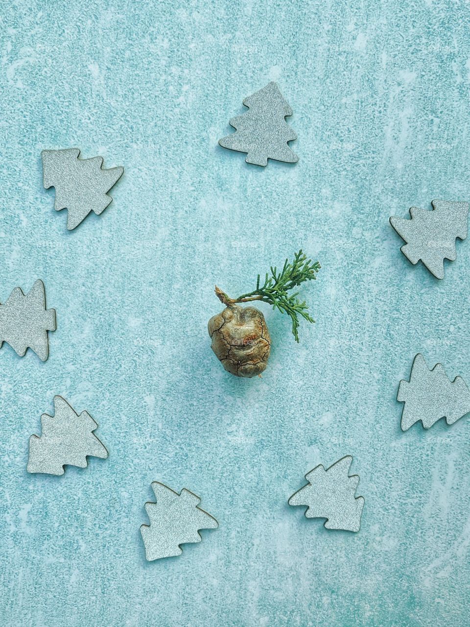 Christmas or New Year composition.  Fir branches with festive decor on a light blue background. Top view. Flat lay.