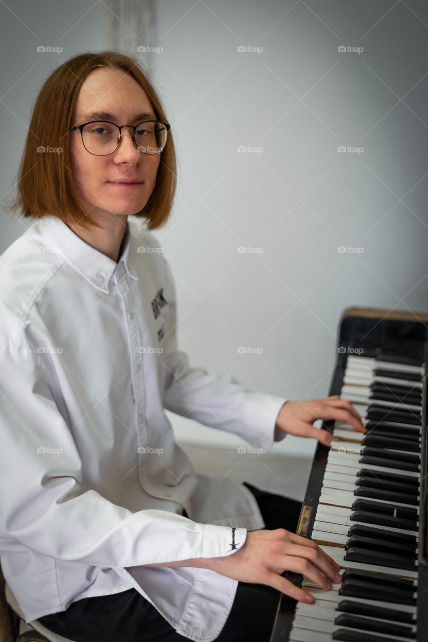 young man playing the piano