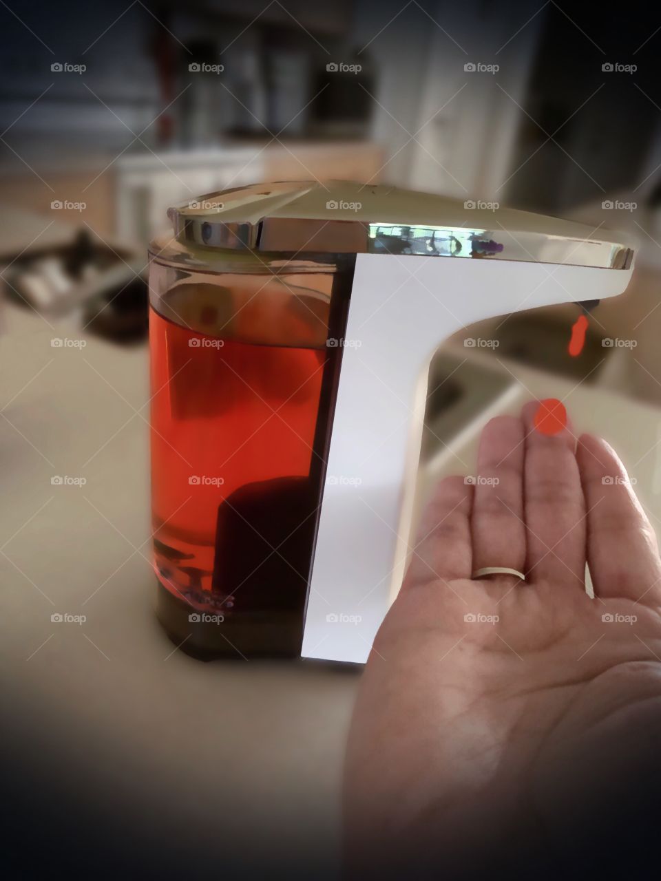 My favorite gadget, a convenient and sleek automatic soap dispenser.