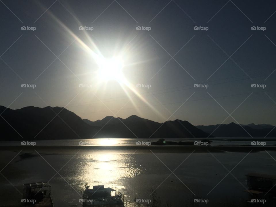 Sun reflection above the lake 