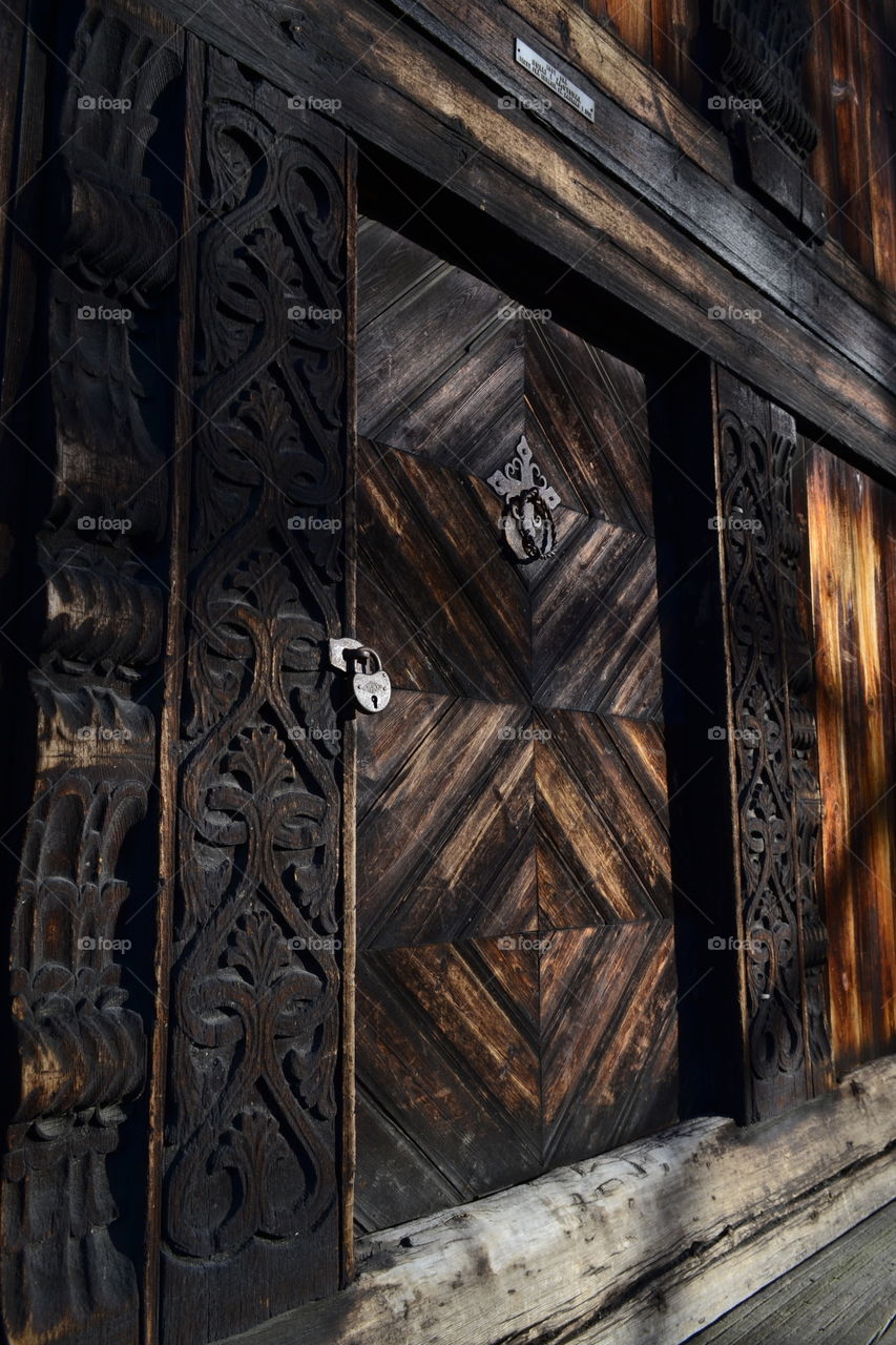 Old brown wooden door of house