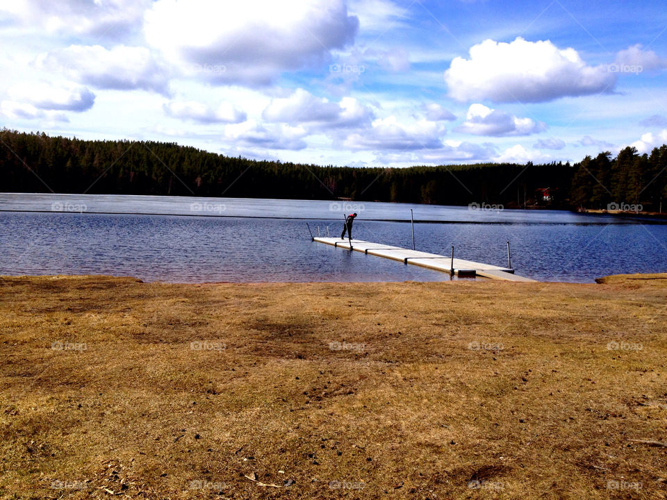 clouds trees lake man by leta