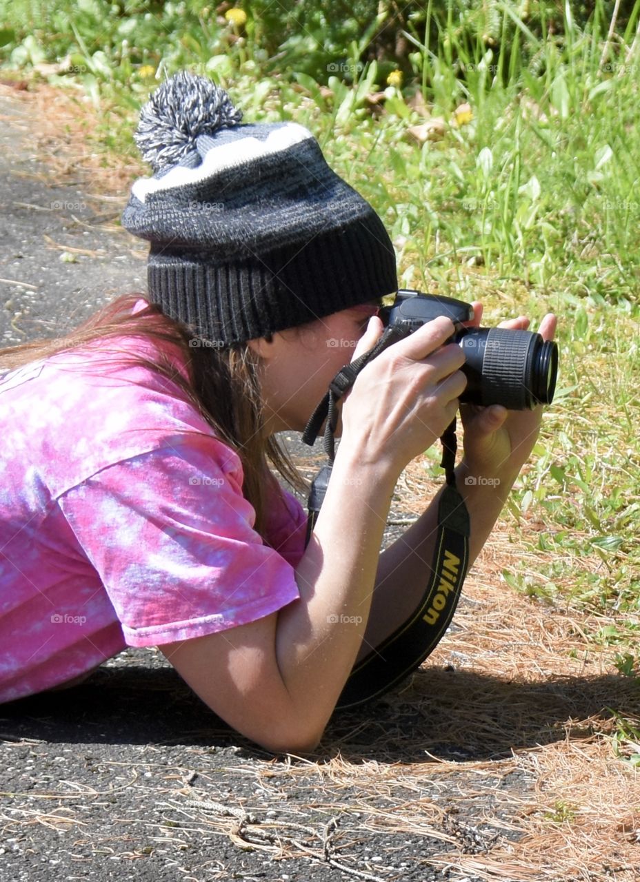 I love photography, a woman taking outside photos