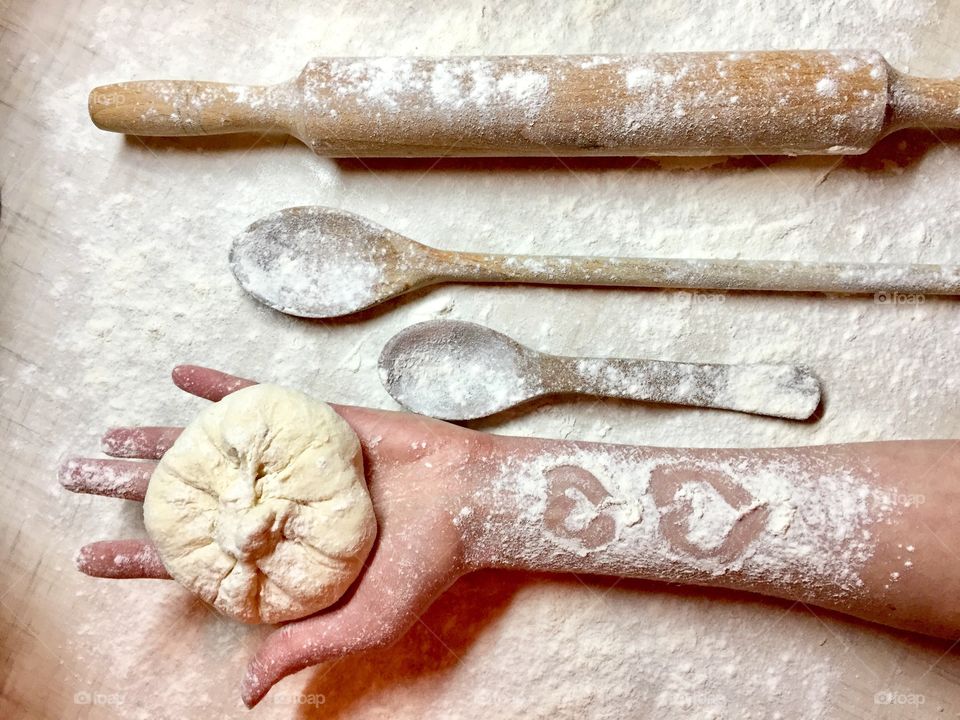 Person hand holding dough