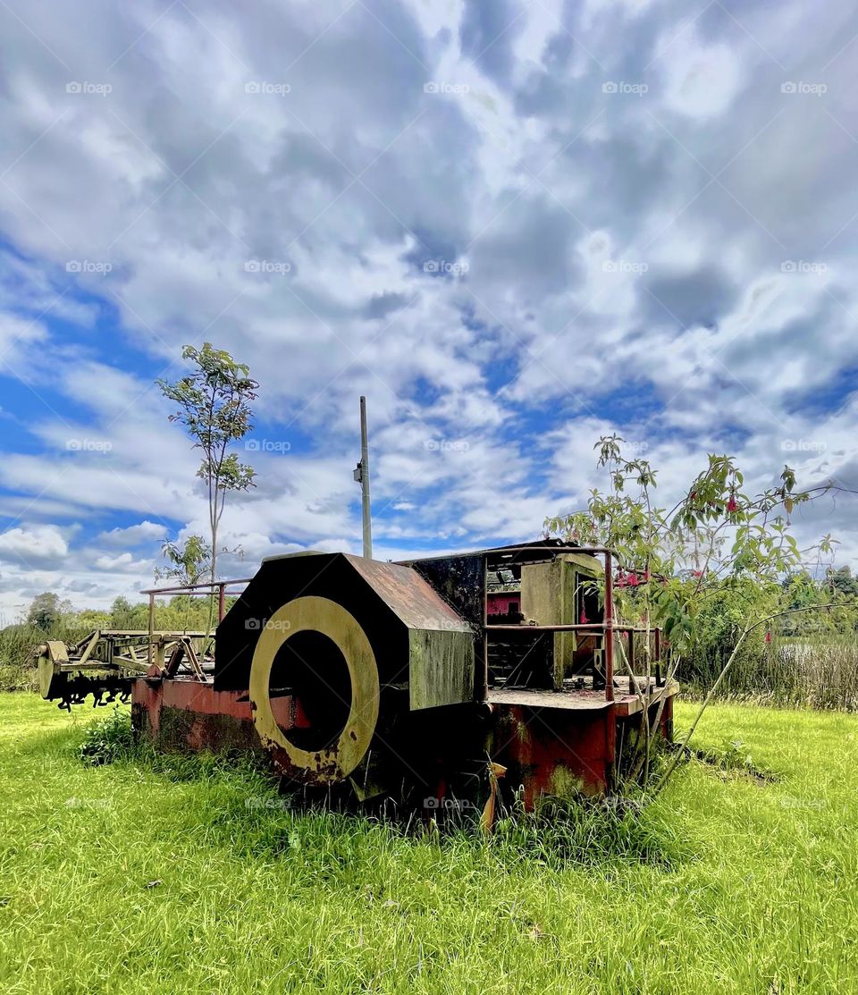 An old machine in the middle of the field-countryside 