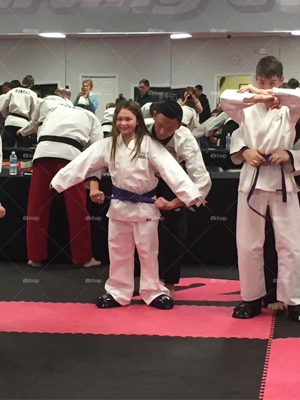 My daughter receiving her purple belt in karate. 