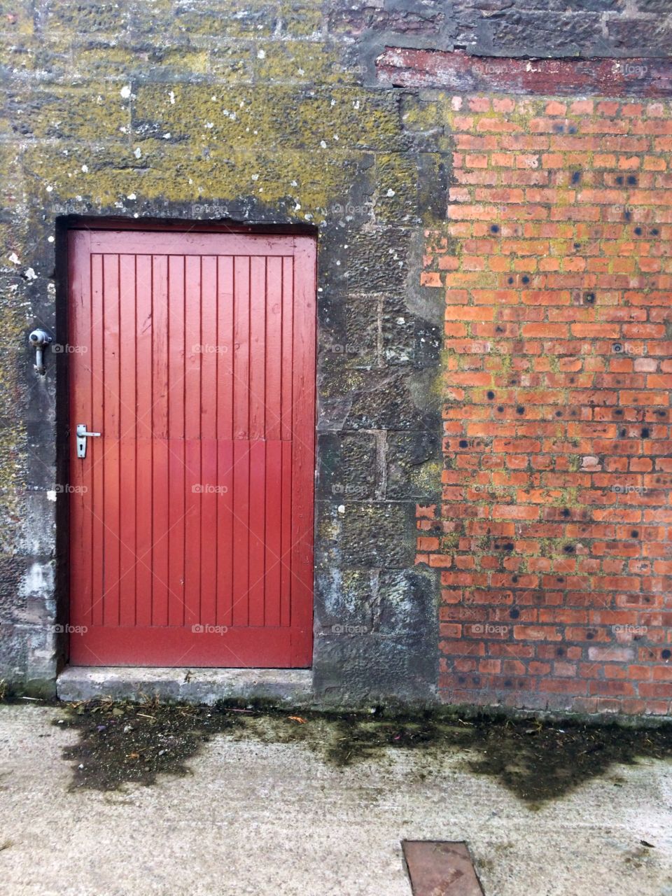 Farm House Door. Lovely red door against the patchy farmhouse wall