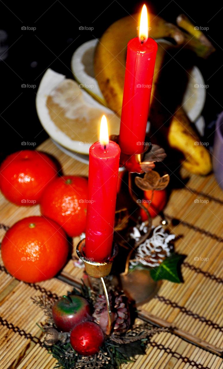 Red candles and fruits 