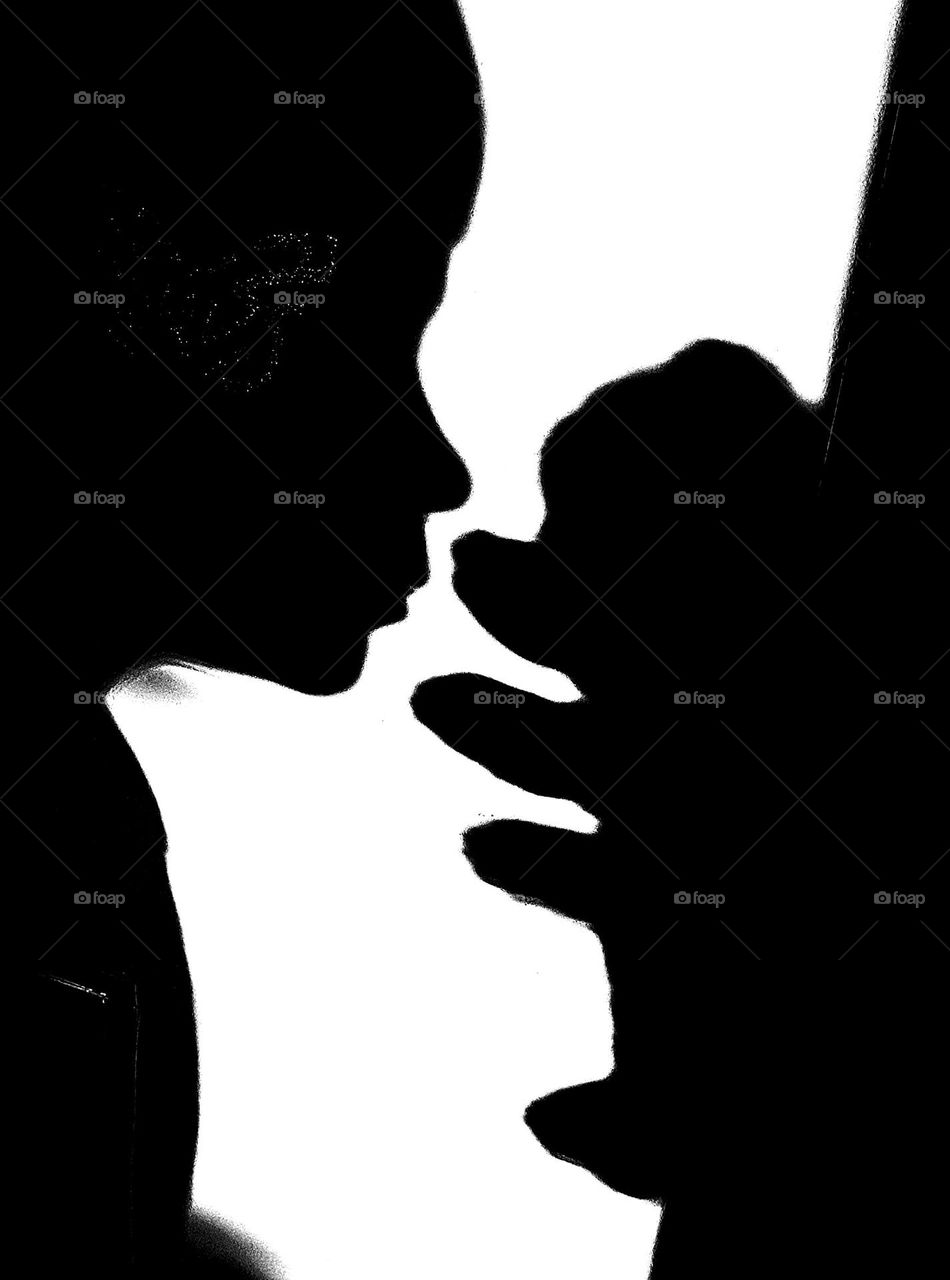 black and white photo of the shadow of a boy and a bear