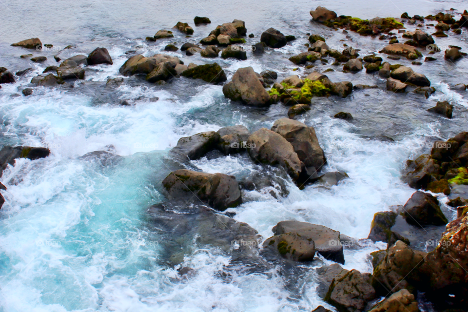 Rushing water over the rocks near Lögberg in thingvellir National Park in Iceland 