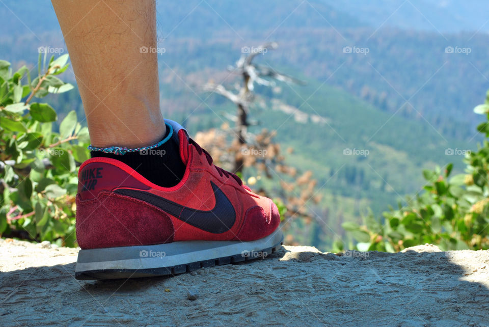 Hiking focus on shoes with a view