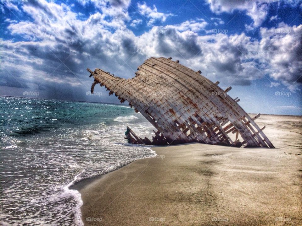 beach clouds ship wreck ocean by cindysaz1