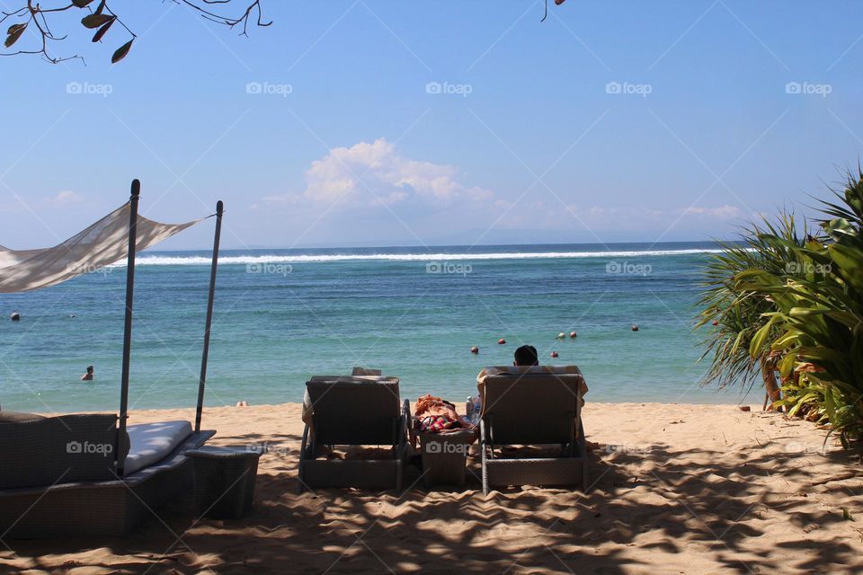 Leisure resort lifestyle and panoramic nature views of Nusa Dua coastline on Bali island. 