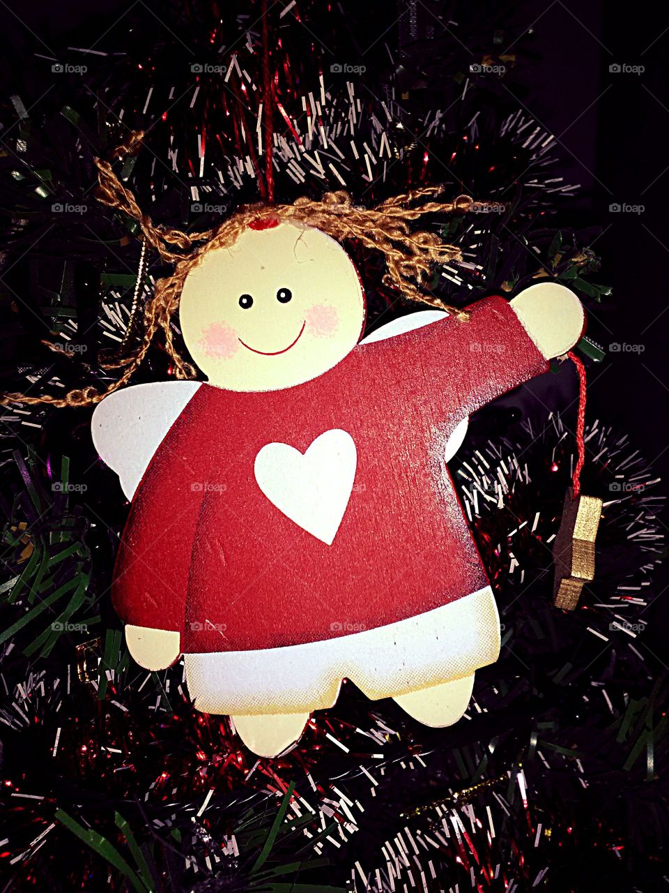 miniature toy Angel on a Christmas tree