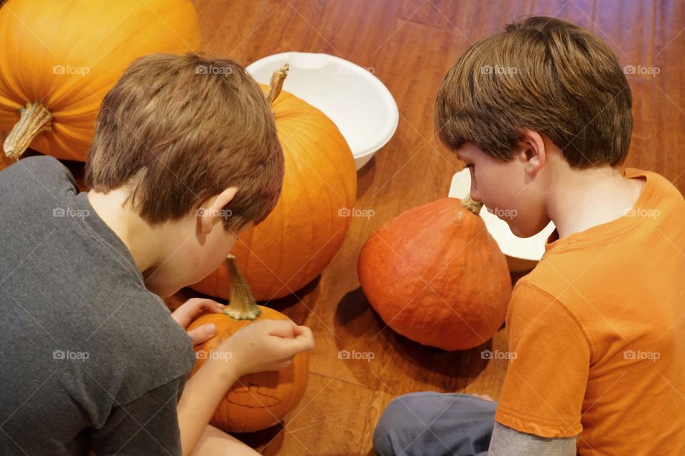 Young Brothers Carving Halloween Pumpkins