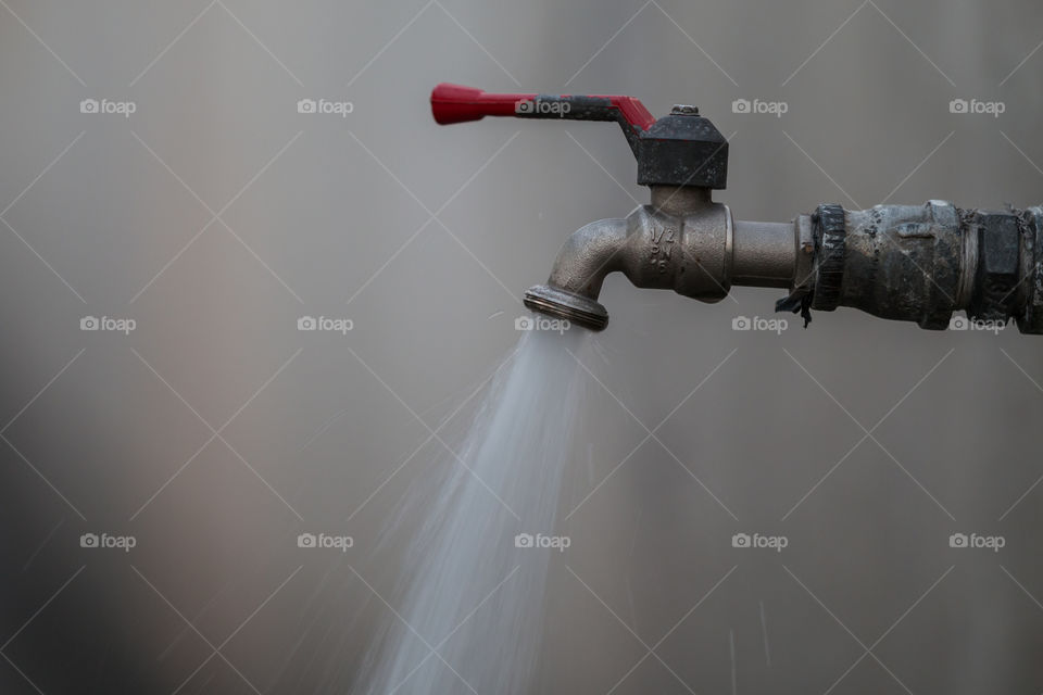 Opened Faucet with water