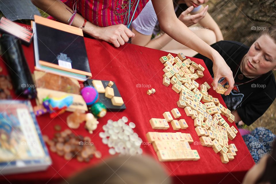 Playing table games  with friends mahjong  