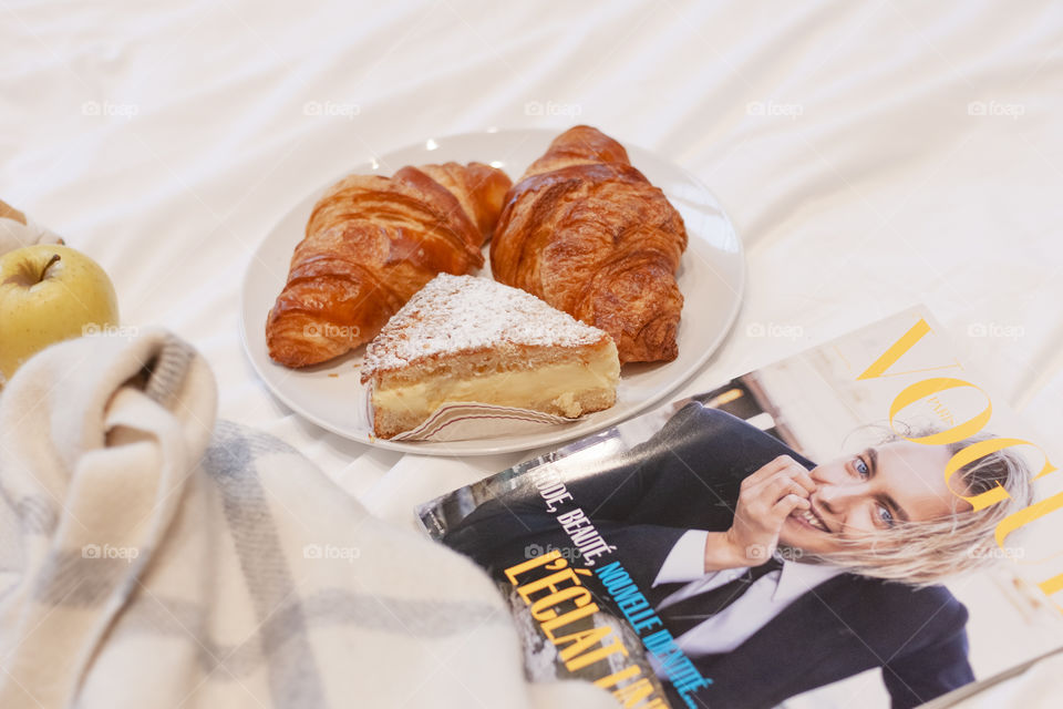 Croissants, cake and magazine