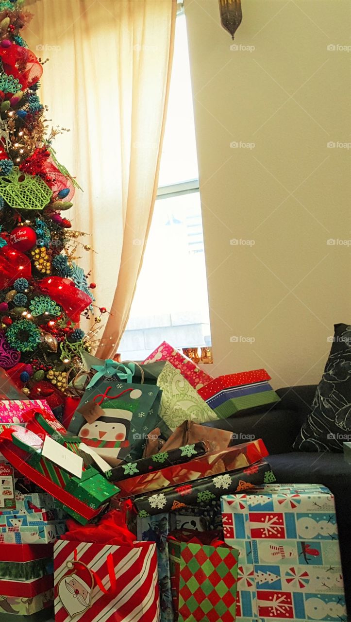 Christmas tree by the window, presents