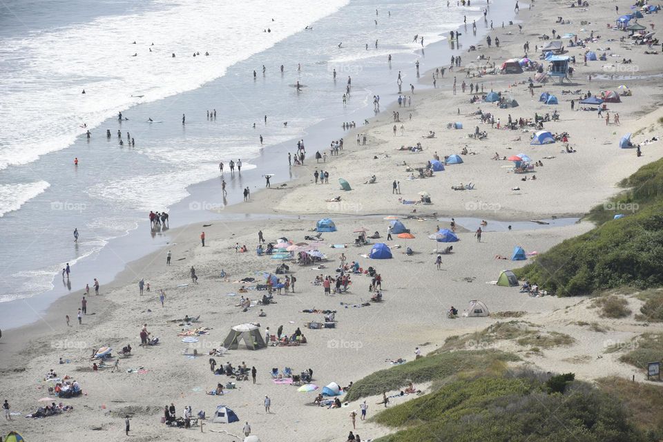 People enjoying the beach on a sunny day.