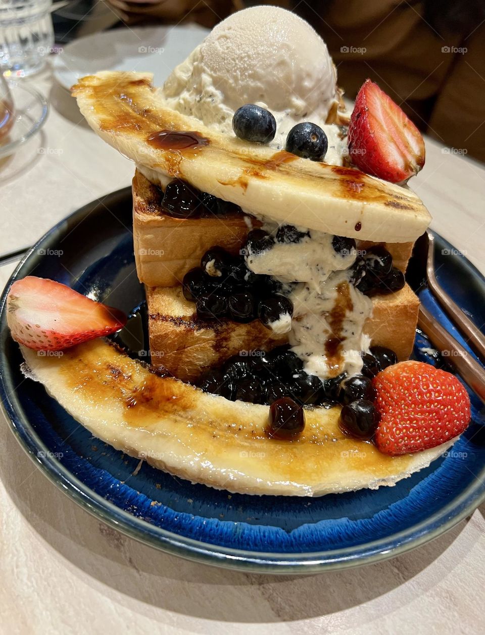 Delicious dessert with fruit and ice cream