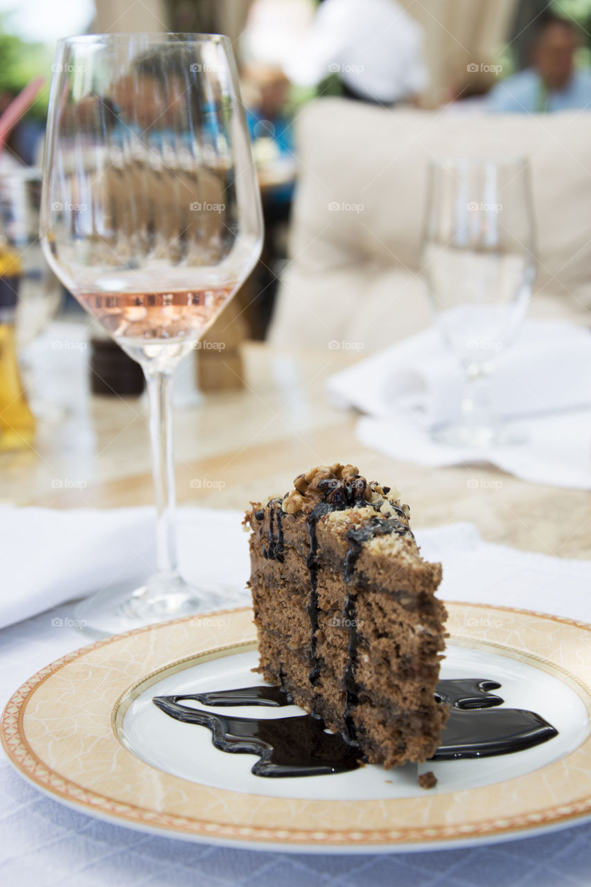 chocolate cake. chocolate cake and glass of rose wine