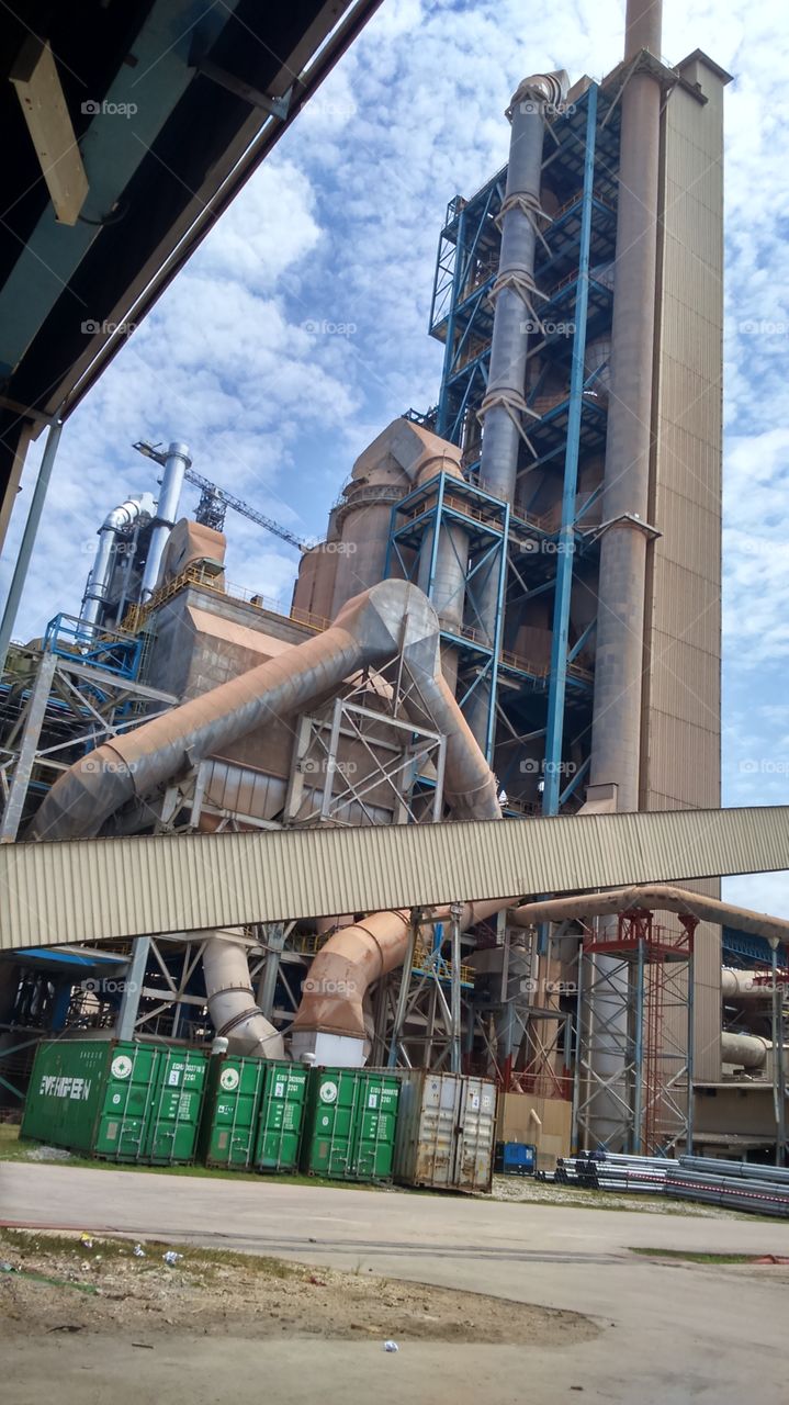 Intermediate part in a process of changing raw material to product, named as preheater tower..