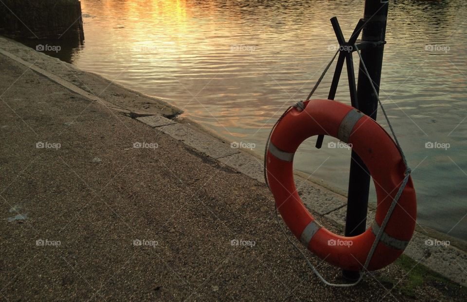 Buoy on a pier in the golden hour