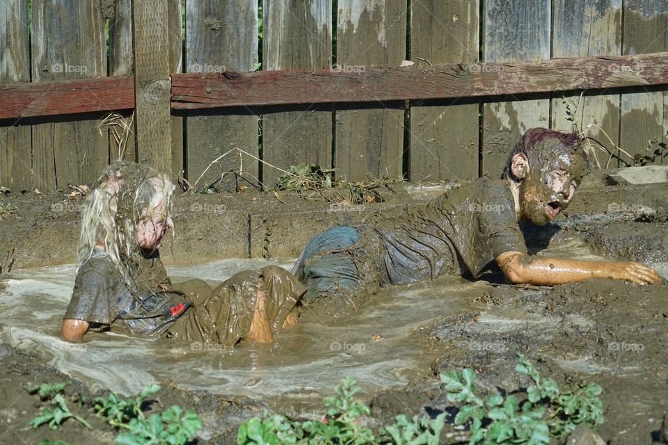 Kids Playing In Mud