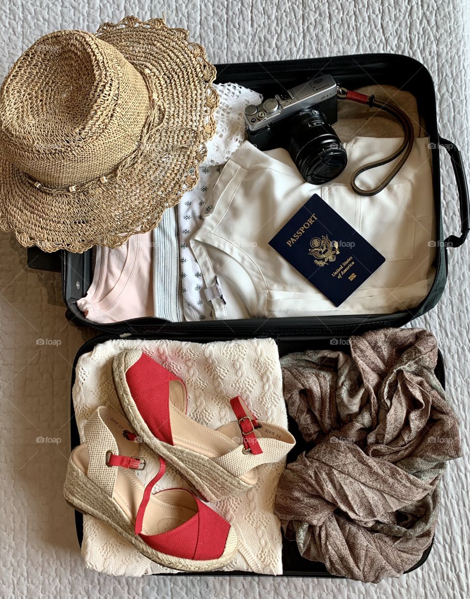 Open Suitcase with passport, clothes & hat/ Packing 