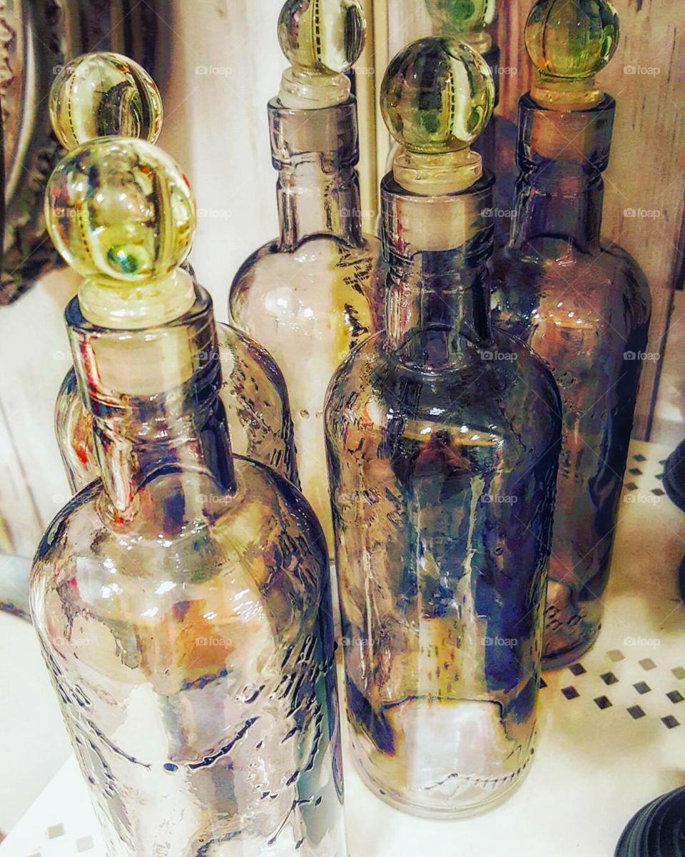 I took this photo at Michaels. these bottles are actually gray, there's just a lot of editing done to bring out colors.