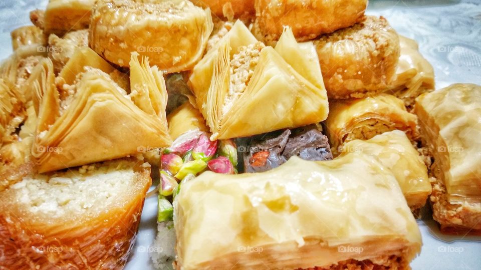 Baklava - different varieties in closeup. Rich, sweet pastry made of layers of filo filled with chopped nuts, sweetened and held together with syrup or honey. Popular around the Mediterranean, Central and West Asia.