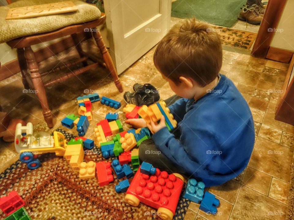 Young Boy Building With Blocks