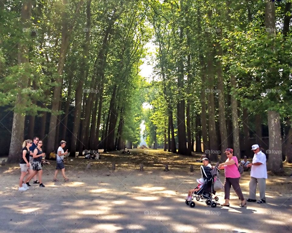 people enjoying les jardins de Versailles Paris 