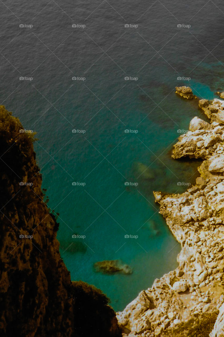 A view of the aquamarine water off the cliffs of the Island of Capri, Italy, 1993. A film photo digitized for a new audience. I have more of the island but a lot of my travel photos are water or animals! 🇮🇹