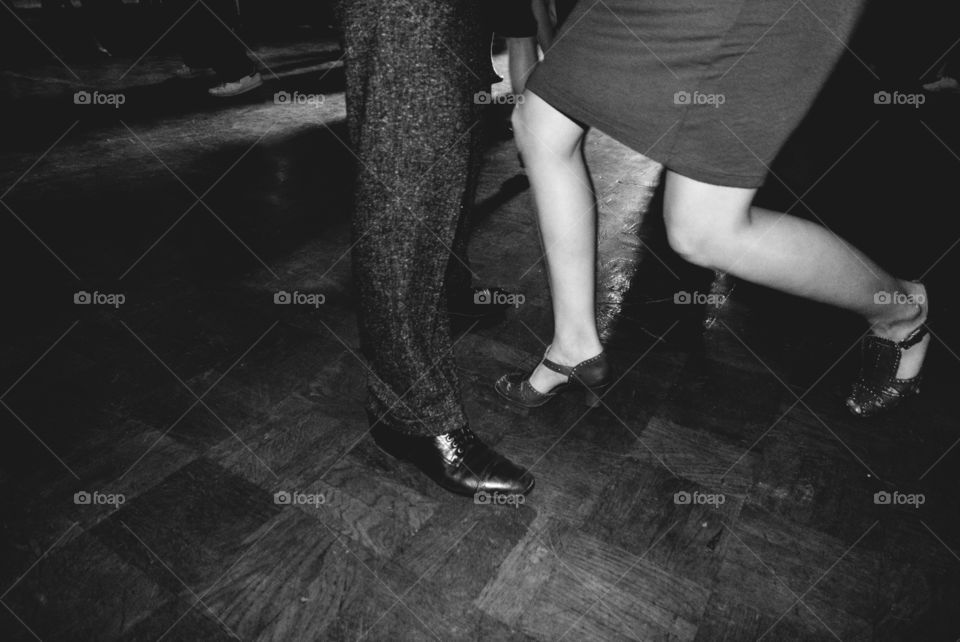 people dancing in vintage style at swing party bottom view on the legs